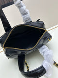 Black patent leather quilted Boston bag